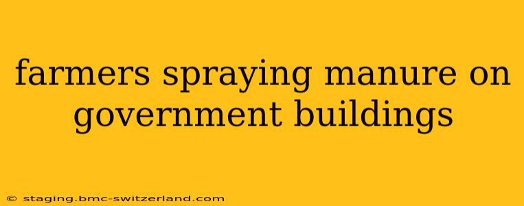 farmers spraying manure on government buildings